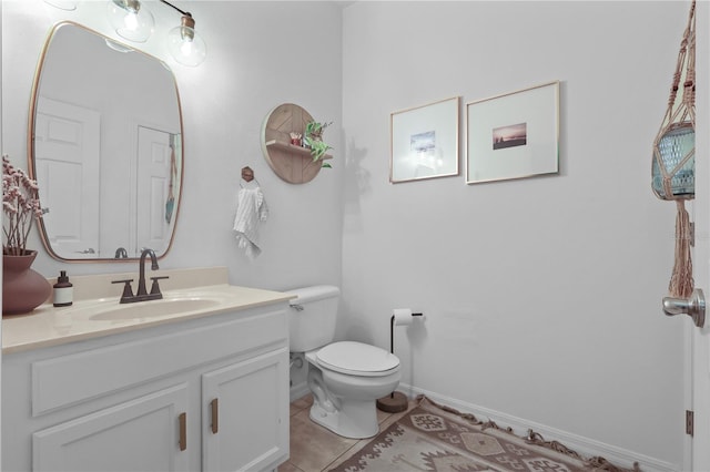 2762 Pepper Ln, Orlando, FL 32812 - bathroom featuring vanity, toilet, tile patterned flooring, and baseboards
