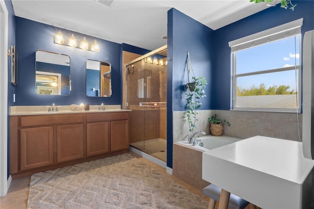 2762 Pepper Ln, Orlando, FL 32812 - full bath featuring tile patterned flooring, a stall shower, a garden tub, and double vanity