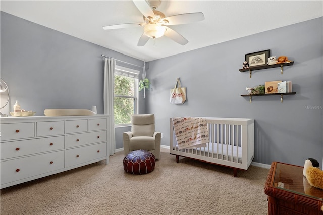 2762 Pepper Ln, Orlando, FL 32812 - bedroom featuring a nursery area, carpet, a ceiling fan, and baseboards