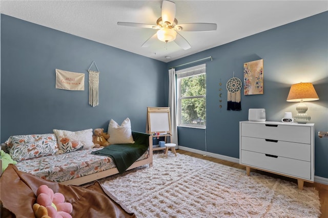2762 Pepper Ln, Orlando, FL 32812 - bedroom featuring baseboards, wood finished floors, and ceiling fan