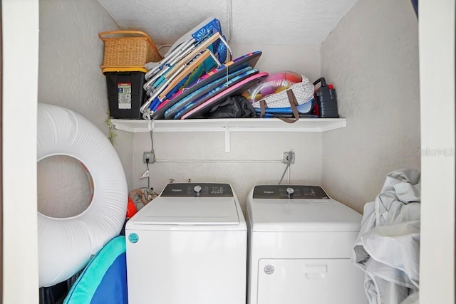 5800 N Banana River Blvd Unit 128, Cape Canaveral, FL 32920 - laundry area featuring independent washer and dryer, a textured ceiling, and a textured wall