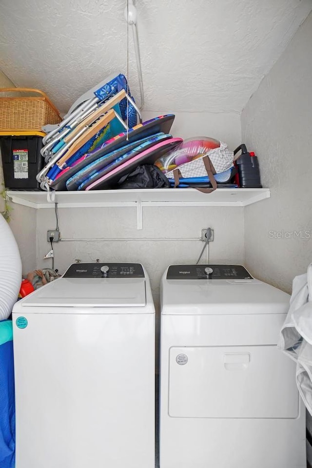 5800 N Banana River Blvd Unit 128, Cape Canaveral, FL 32920 - laundry room with independent washer and dryer and a textured ceiling