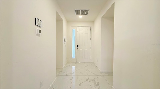 3880 Sonoma Blvd, Kissimmee, FL 34741 - foyer entrance with baseboards and light marble finish flooring