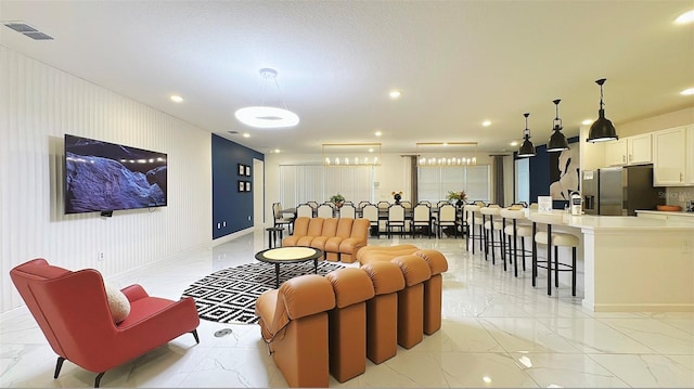 3880 Sonoma Blvd, Kissimmee, FL 34741 - living area featuring light marble finish flooring, baseboards, and recessed lighting