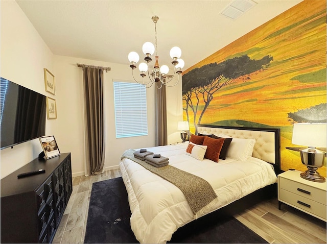 3880 Sonoma Blvd, Kissimmee, FL 34741 - bedroom featuring a chandelier, light wood-style floors, and baseboards