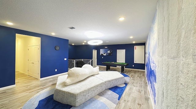 3880 Sonoma Blvd, Kissimmee, FL 34741 - bedroom featuring pool table, light wood-style flooring, baseboards, a textured ceiling, and recessed lighting