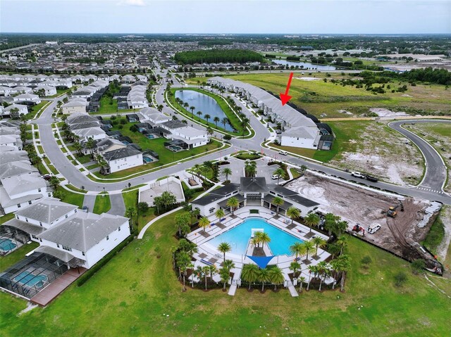 3880 Sonoma Blvd, Kissimmee, FL 34741 - aerial view of property and surrounding area featuring a pool, a large body of water, and nearby suburban area