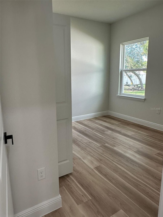 3063 SW 168th Loop, Ocala, FL 34473 - empty room featuring wood finished floors and baseboards