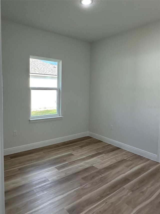 3063 SW 168th Loop, Ocala, FL 34473 - spare room featuring wood finished floors, baseboards, and recessed lighting