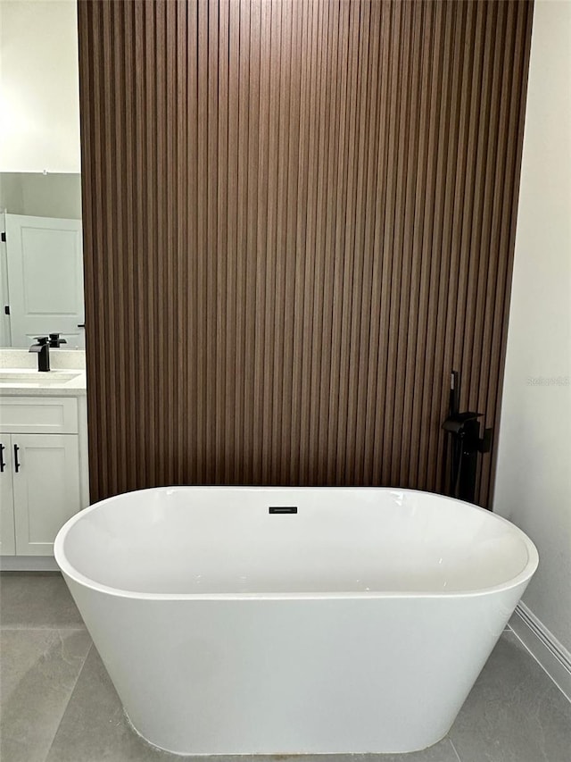 3063 SW 168th Loop, Ocala, FL 34473 - full bath featuring vanity, a soaking tub, and baseboards