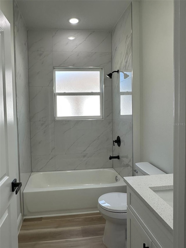 3063 SW 168th Loop, Ocala, FL 34473 - full bathroom with wood finished floors, toilet, bathtub / shower combination, vanity, and recessed lighting