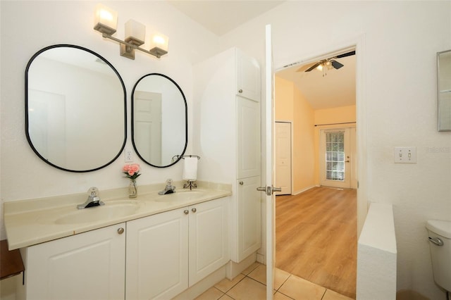 2493 Lancien Ct Unit 5, Orlando, FL 32826 - bathroom featuring tile patterned floors, double vanity, ceiling fan, and lofted ceiling