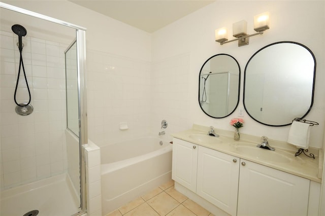 2493 Lancien Ct Unit 5, Orlando, FL 32826 - full bathroom featuring a shower stall, double vanity, tile patterned floors, and a tub