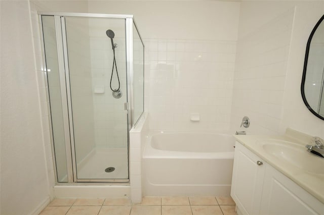 2493 Lancien Ct Unit 5, Orlando, FL 32826 - bathroom featuring a stall shower, tile patterned floors, a bath, and vanity