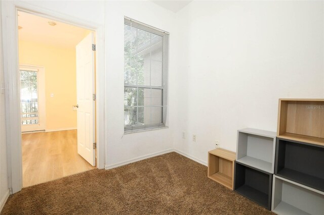 2493 Lancien Ct Unit 5, Orlando, FL 32826 - spare room featuring baseboards and carpet flooring