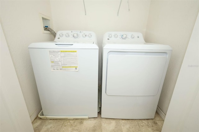 2493 Lancien Ct Unit 5, Orlando, FL 32826 - washroom featuring washing machine and dryer and baseboards