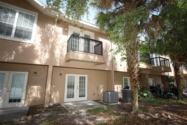 2493 Lancien Ct Unit 5, Orlando, FL 32826 - back of property with french doors, a balcony, and stucco siding