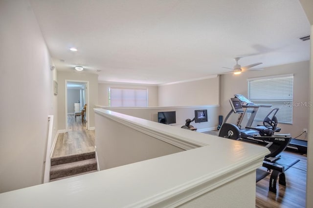 hall with wood finished floors, baseboards, and recessed lighting