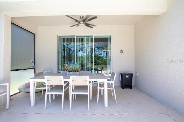 view of patio featuring outdoor dining area and ceiling fan