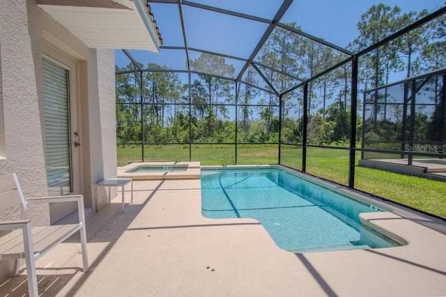 view of swimming pool with a patio area, a lanai, and a pool with connected hot tub