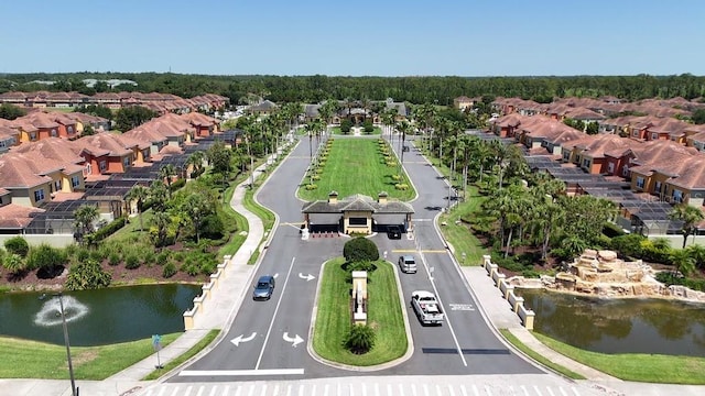 aerial view of residential area featuring a nearby body of water