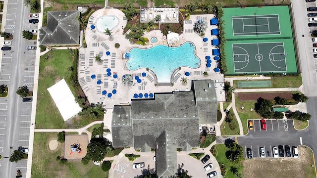 aerial view of property's location featuring a pool area