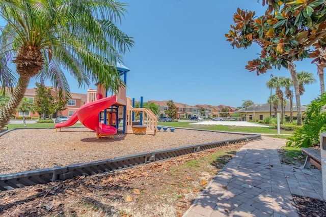 community playground featuring a residential view and volleyball court
