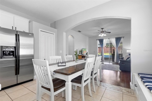 714 Home Grove Dr, Winter Garden, FL 34787 - dining area with arched walkways, ceiling fan, and light tile patterned flooring