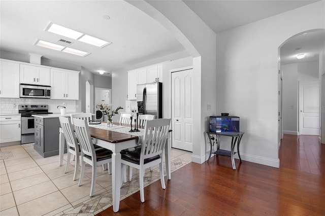 714 Home Grove Dr, Winter Garden, FL 34787 - dining space with light wood-style flooring and baseboards