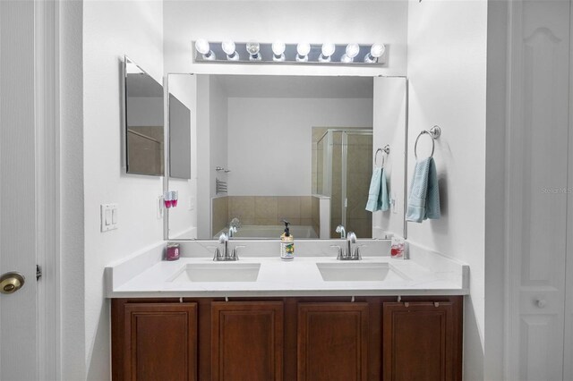 714 Home Grove Dr, Winter Garden, FL 34787 - full bathroom featuring a garden tub, a stall shower, and double vanity