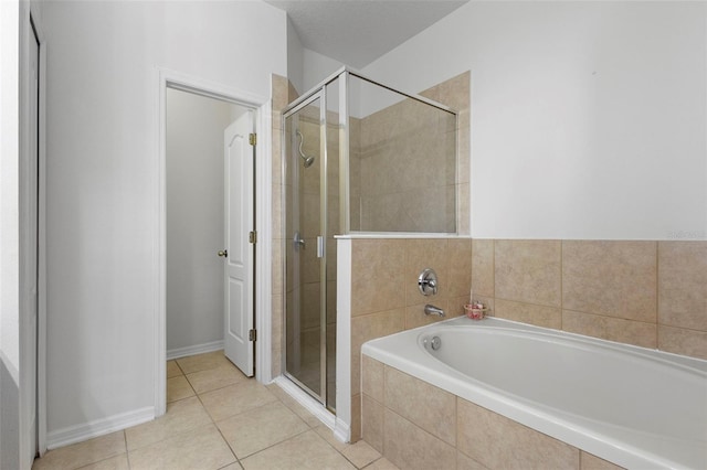 714 Home Grove Dr, Winter Garden, FL 34787 - full bath featuring a garden tub, a shower stall, and tile patterned floors