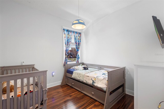 714 Home Grove Dr, Winter Garden, FL 34787 - bedroom featuring baseboards and dark wood finished floors