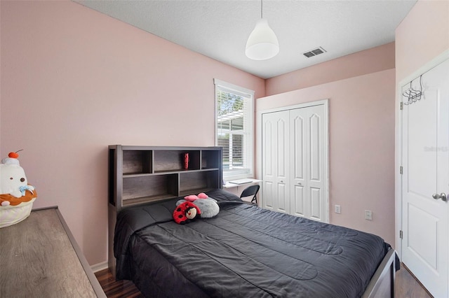 714 Home Grove Dr, Winter Garden, FL 34787 - bedroom with wood finished floors, a closet, and baseboards