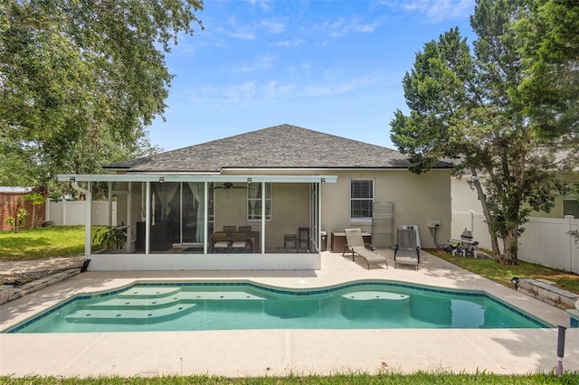 714 Home Grove Dr, Winter Garden, FL 34787 - back of house featuring a sunroom, stucco siding, a fenced backyard, a patio, and a shingled roof