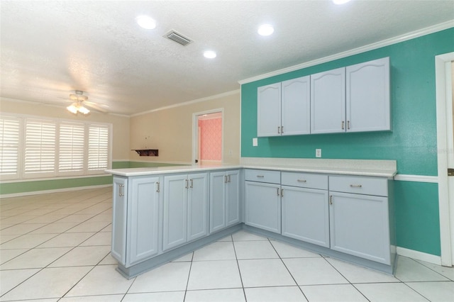 645 Peachwood Dr, Altamonte Springs, FL 32714 - kitchen featuring a peninsula, ceiling fan, light countertops, ornamental molding, and baseboards