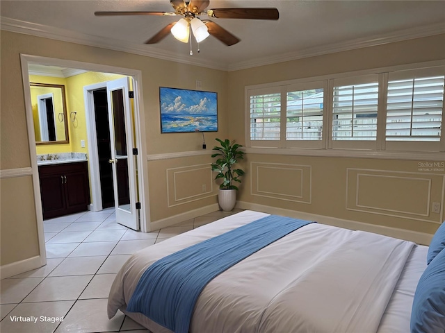 645 Peachwood Dr, Altamonte Springs, FL 32714 - bedroom with light tile patterned flooring, ornamental molding, ceiling fan, wainscoting, and connected bathroom