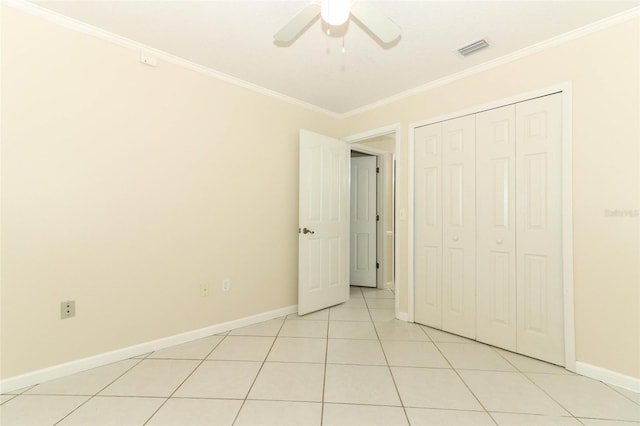 645 Peachwood Dr, Altamonte Springs, FL 32714 - unfurnished bedroom featuring ornamental molding, baseboards, light tile patterned floors, a closet, and a ceiling fan