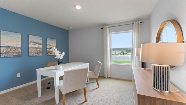 4246 Acoma Dr, Ormond Beach, FL 32174 - dining area featuring carpet flooring, baseboards, and a desk