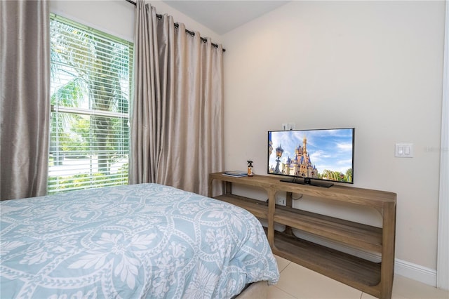 8419 Pippen Dr, Orlando, FL 32836 - tiled bedroom featuring baseboards