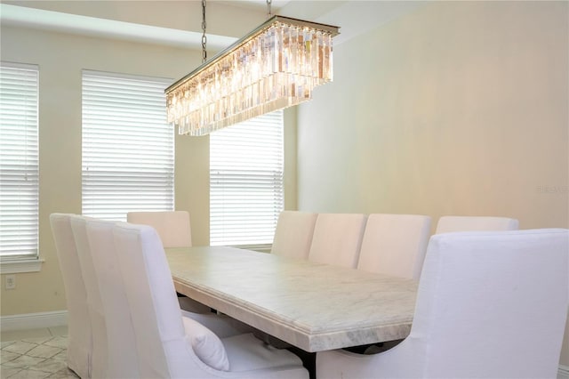 8419 Pippen Dr, Orlando, FL 32836 - dining room featuring baseboards and a chandelier