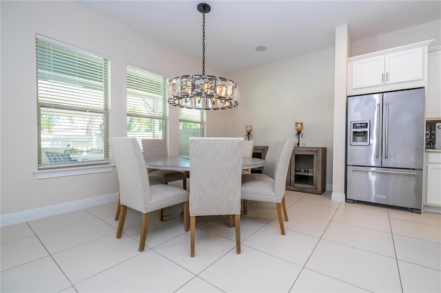 8419 Pippen Dr, Orlando, FL 32836 - dining area featuring a chandelier, healthy amount of natural light, and baseboards