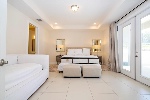 8419 Pippen Dr, Orlando, FL 32836 - bedroom featuring access to outside, a tray ceiling, light tile patterned floors, french doors, and recessed lighting