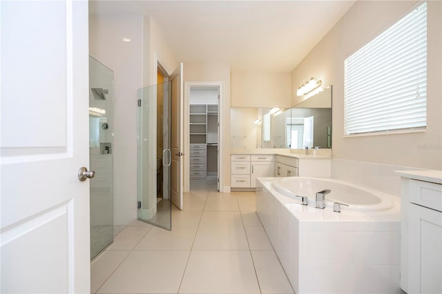 8419 Pippen Dr, Orlando, FL 32836 - full bath with a shower stall, a bath, a spacious closet, tile patterned floors, and vanity