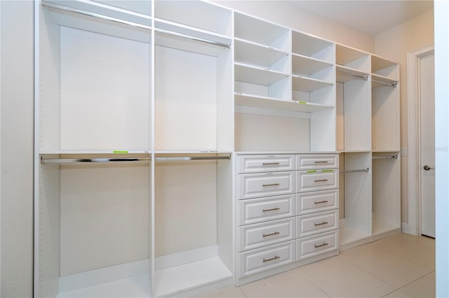 8419 Pippen Dr, Orlando, FL 32836 - walk in closet featuring light tile patterned floors