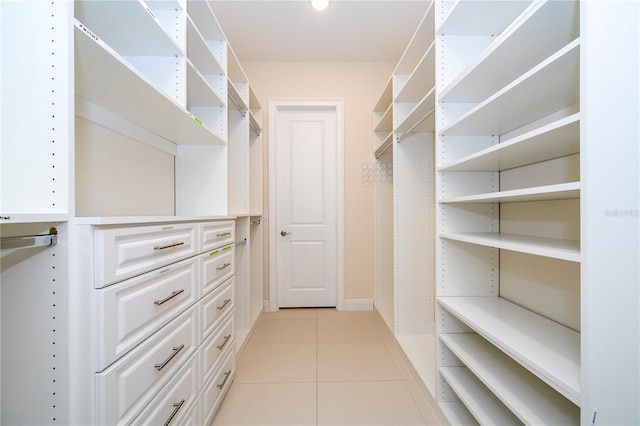 8419 Pippen Dr, Orlando, FL 32836 - walk in closet featuring light tile patterned flooring
