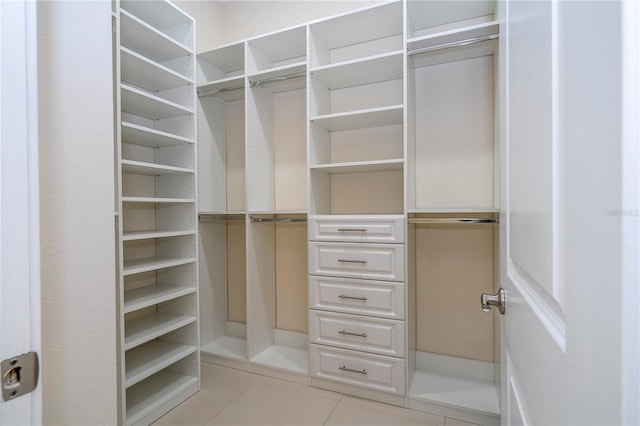 8419 Pippen Dr, Orlando, FL 32836 - spacious closet featuring light tile patterned floors