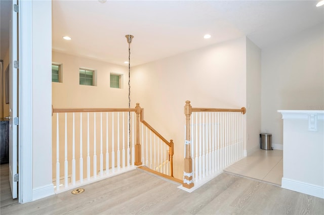 8419 Pippen Dr, Orlando, FL 32836 - hallway featuring an upstairs landing, wood finished floors, recessed lighting, and baseboards