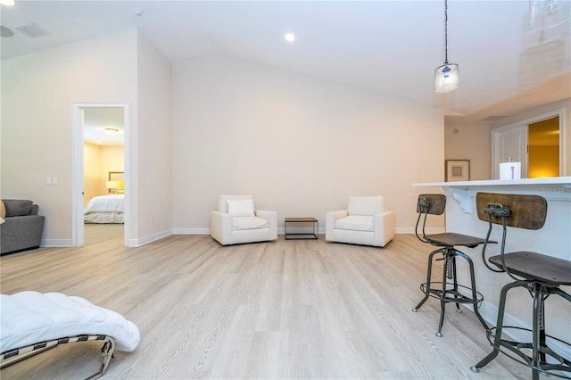 8419 Pippen Dr, Orlando, FL 32836 - living room with wood finished floors, vaulted ceiling, baseboards, and recessed lighting