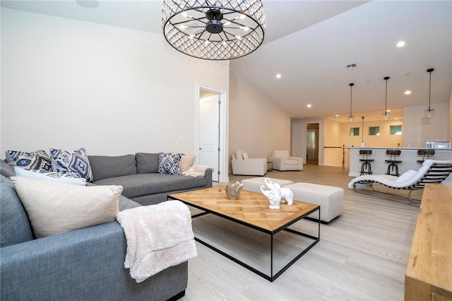 8419 Pippen Dr, Orlando, FL 32836 - living area featuring light wood-style flooring, recessed lighting, and vaulted ceiling