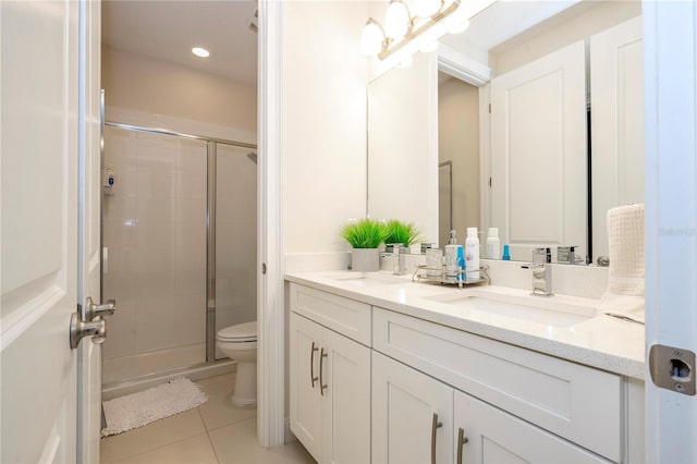 8419 Pippen Dr, Orlando, FL 32836 - bathroom featuring a stall shower, tile patterned floors, toilet, double vanity, and recessed lighting